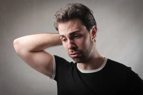 Brooding Man Väggen — Stockfoto