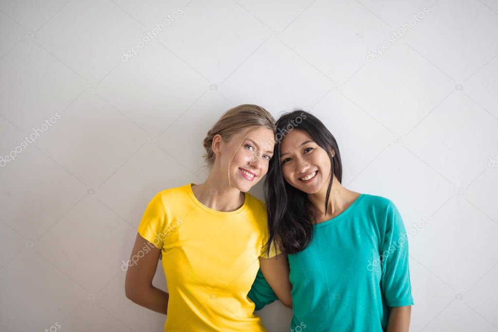 portrait of smiling woman in colourful shirts