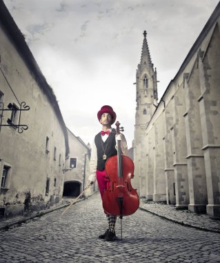 violin player in an anthic street clipart