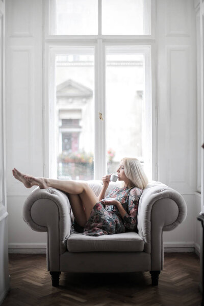 Blonde Fashion Model Relaxing Couch Looking Out Window — Stock Photo, Image