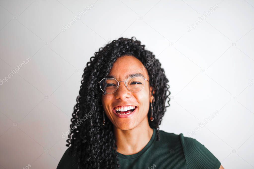 A girl is smiling to the camera