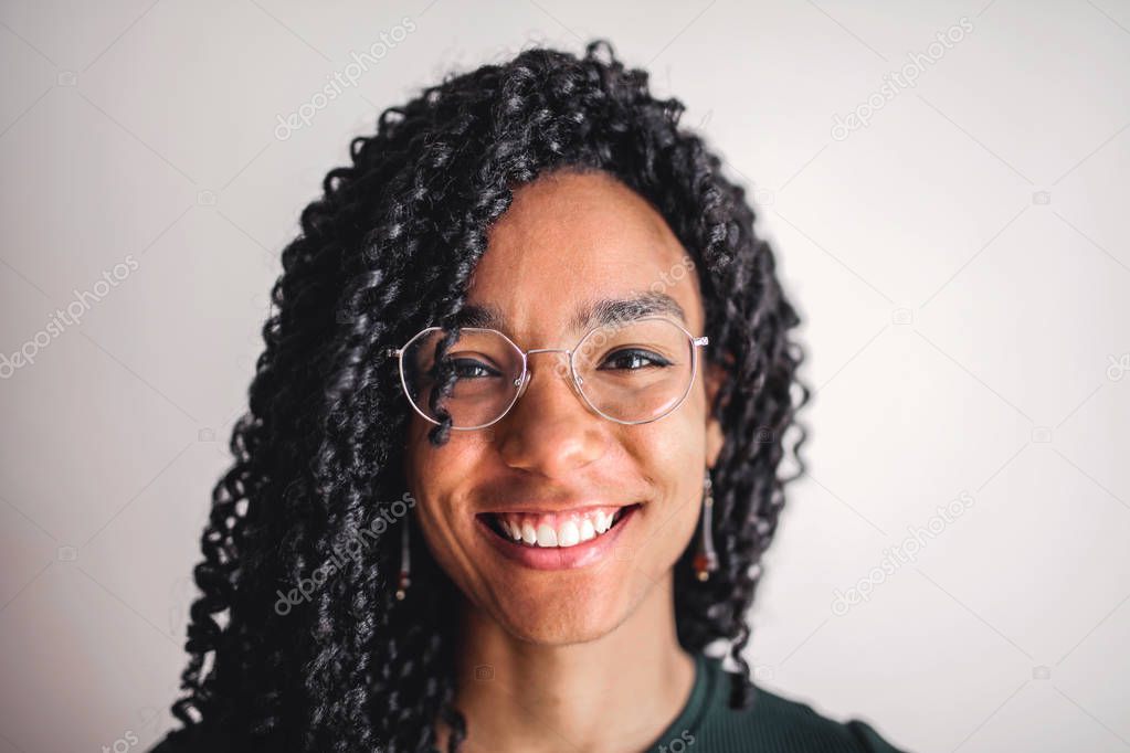 A girl is smiling to the camera