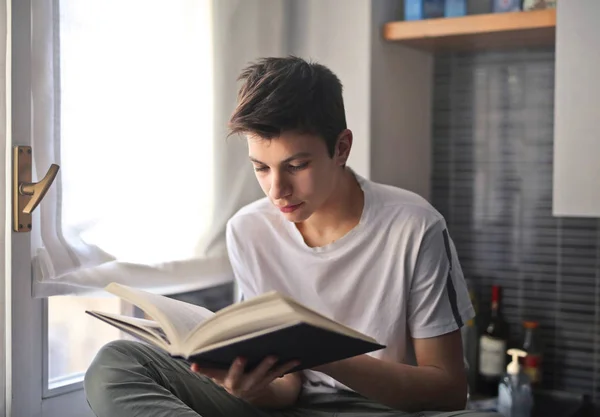 Teenager Reading Window — ストック写真