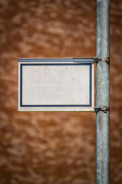 Grungy Blank White Street Sign Your Text Blurred Brick Wall — стоковое фото