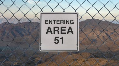 Entering Area 51 Sign On A Fence At The Military Base In The Nevada Desert At Sunset clipart