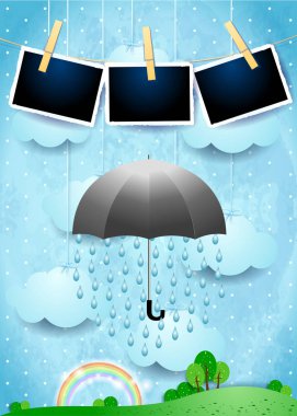 Şemsiye ve fotoğraf çerçeveleri ile yağmur ile gerçeküstü manzara 