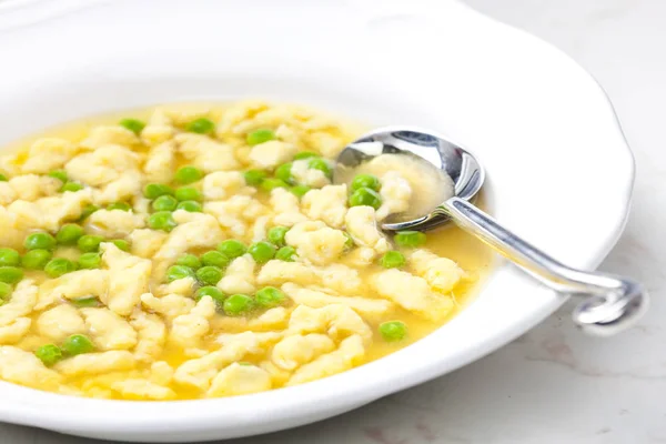 Beef bouillon with dumplings — Stock Photo, Image