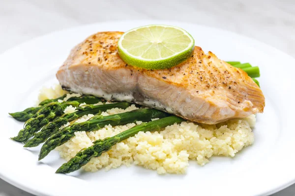 Salmon with asparagus and couscous — Stock Photo, Image