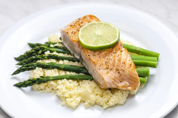 Salmon with asparagus and couscous — Stock Photo, Image