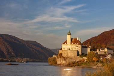 Small castle Schonbuhel above the Danube in the romantic sunset, clipart