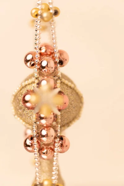 silver-gold Christmas ornament with corals