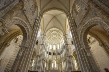Wide angle view of the nave and vaulted arches inside the Vezelay Abbey, a UNESCO World Heritage site in France
