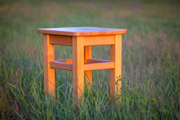 Abstract Wooden Stool Green Meadow — Stock Photo, Image