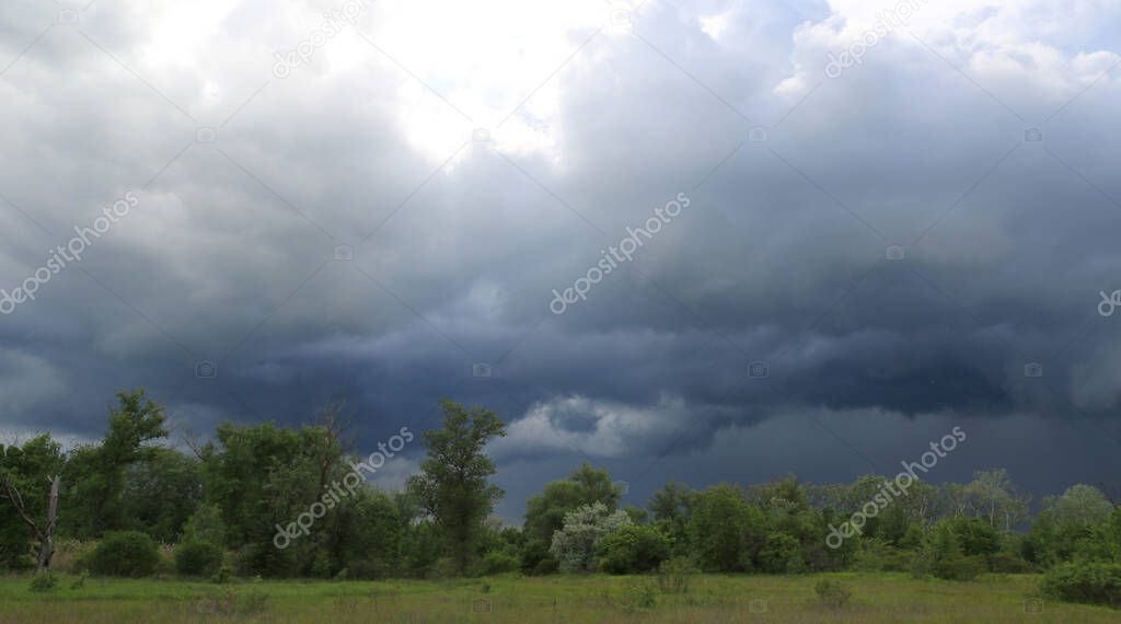 dark clouds in thunderstorm sky in steppe