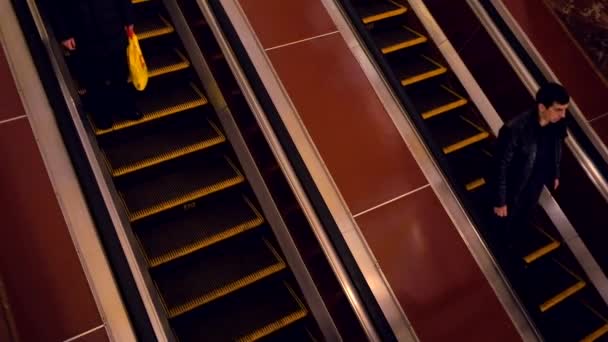 Passengers ride on the escalator at subway station — Stock Video