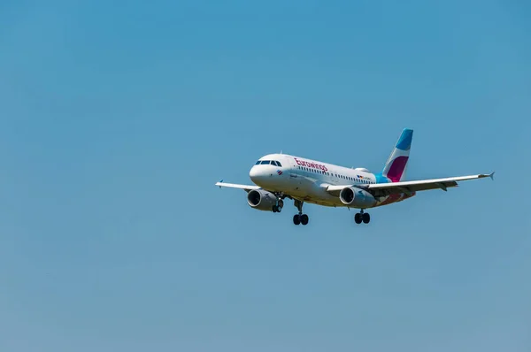 Eurowings airlines airplane preparing for landing at day time in international airport — Stock Photo, Image