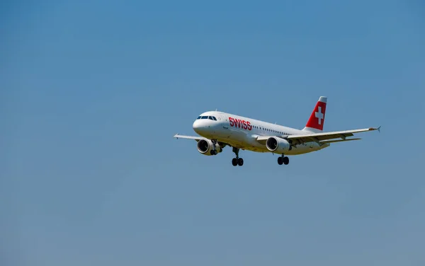 Swiss airlines airplane preparing for landing at day time in international airport — Stock Photo, Image