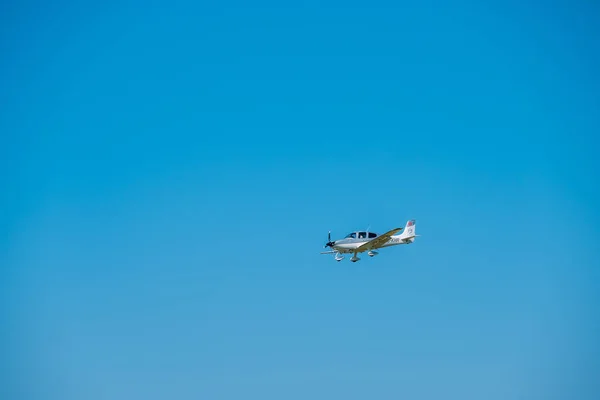 Small private jet airplane preparing for landing at day time in international airport — Stock Photo, Image