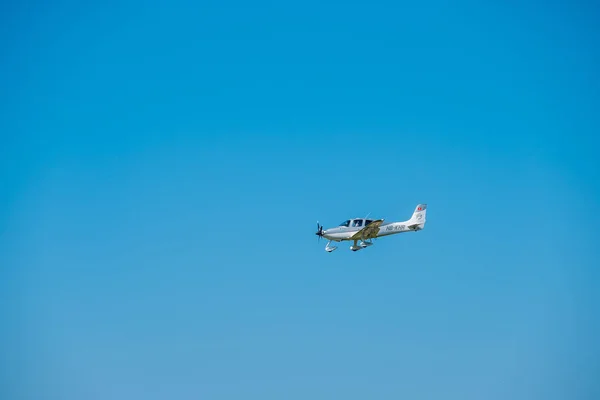 Small private jet airplane preparing for landing at day time in international airport — Stock Photo, Image