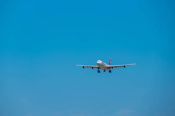 Swiss airlines airplane preparing for landing at day time in international airport — Stock Photo, Image