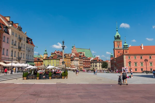 People walking in old city centre at sunny day time — Stock Photo, Image