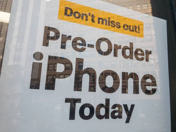 Pre-order Iphone today baner at the electronics shop window — Stock Photo, Image