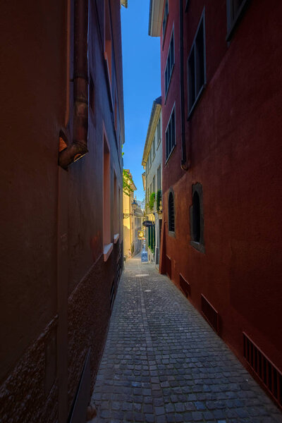 Zurich, Switzerland - July 19, 2018: Narrow street landscape in old city at sunny day time