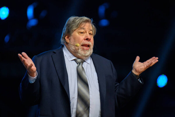 Apple corporation co-founder Stephen Wozniak performs at business conference