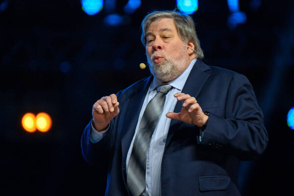 Apple corporation co-founder Stephen Wozniak performs at business conference