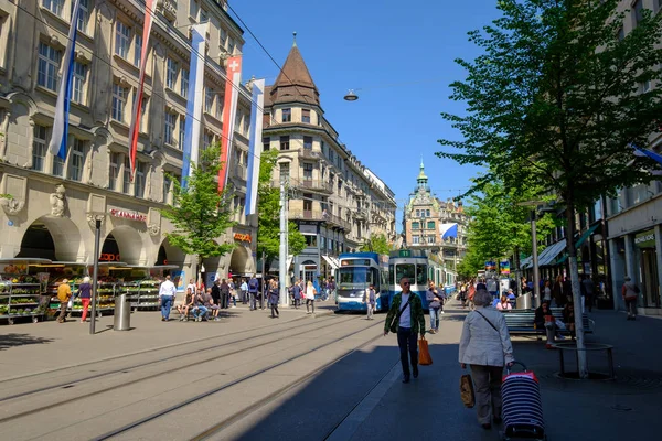 People and city transport at Bahnhofstrasse at the morning time — Stock Photo, Image