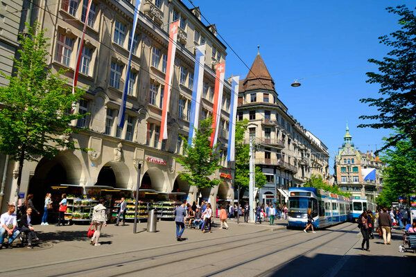 People and city transport at Bahnhofstrasse at the morning time