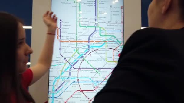 Women exploring subway interactive map — ストック動画