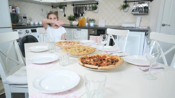 Girl is waiting for guests at the kitchen — Stock Video