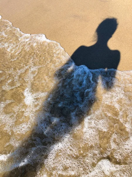 Young woman shadow on a sand — Stock Photo, Image