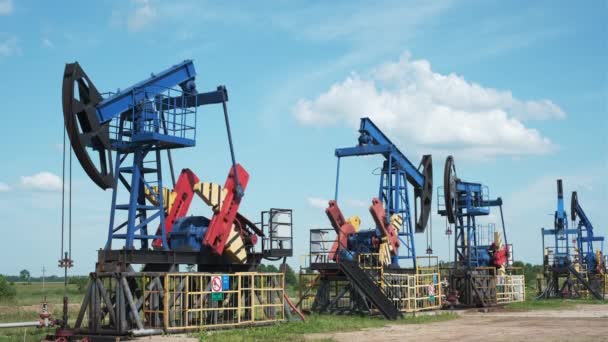 Oil derricks against cloudy sky — Stock Video