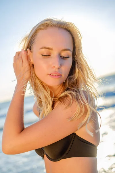 Charming woman in bikini on beach — Stock Photo, Image