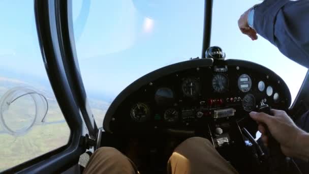 Crop man piloting plane over countryside — Stock Video