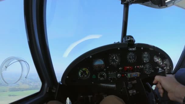 Crop man piloting plane over countryside — Stock Video