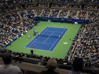 NEW YORK - SEPTEMBER 6: A crowded Arthur Ashe Stadium, under a closed roof, for a U.S. Open tennis match Vandeweghe vs Pliskova on September 6, 2017 in New York. The roof was installed in time for the 2016 tournament. clipart