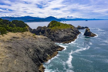 Beautiful seascape with rocks and sandy beach.Samuel Boardman scenic corridor near Brookings, Oregon, USA. clipart