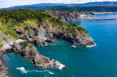 Beautiful seascape with rocks and sandy beach.Samuel Boardman scenic corridor near Brookings, Oregon, USA. clipart