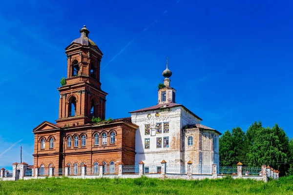 Old church with a bell tower in the village — Stock Photo, Image