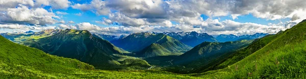 Caucasian mountains and cloudy sky on a summer day — Stock Photo, Image