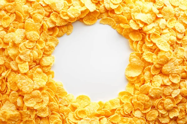 Golden Cornflakes full frame with empty round copy space in the middle as viewed from above