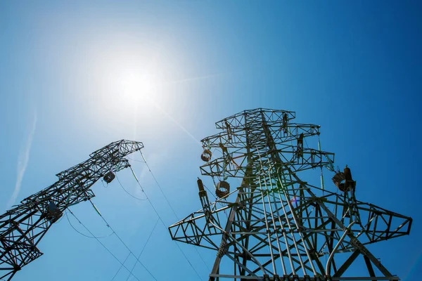 Power tower in the sky background, high-voltage post or high-voltage tower in the sunlight