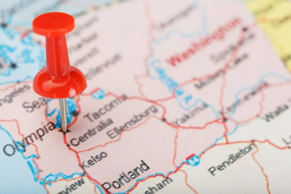 Red clerical needle on map of USA, Washington and DC. Close up map of Washington with red tack