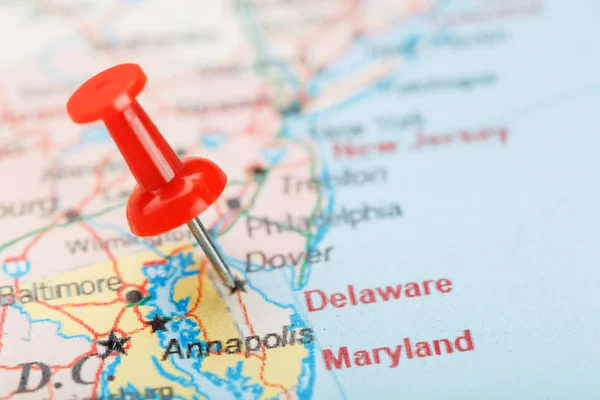 Red clerical needle on a map of USA, South Delaware and the capital Dover. Close up map of Delaware Carolina with red tack