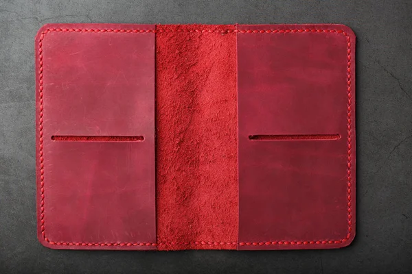 Open the red leather cover for your passport. Genuine leather, handmade. Close stitching