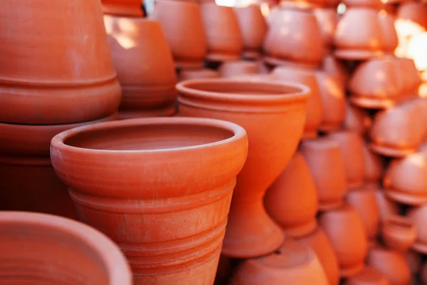 Handmade ceramic crockery made of clay of brown terracotta color