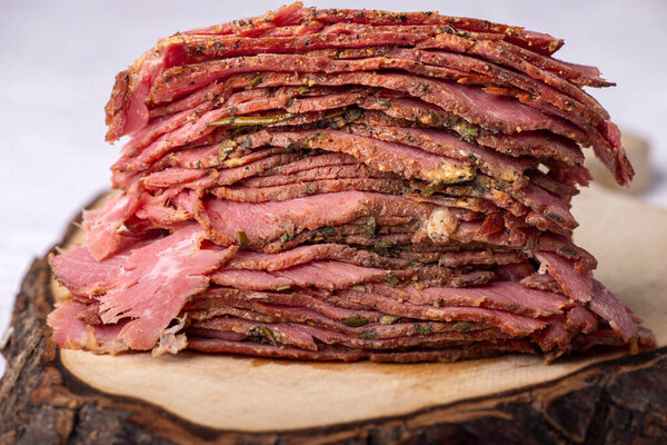 stack of sliced pastrami meat